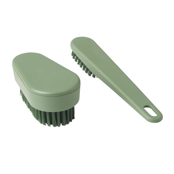 A green PEPPRIG scrubbing brush