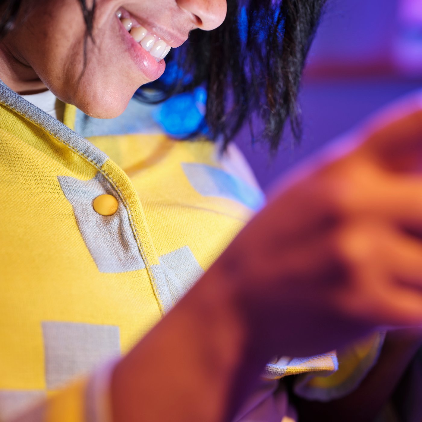 A pale blue/bright yellow BRÄNNBOLL throw