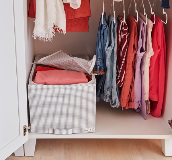 A white STAJLIG hanger, in/outdoor in the bedroom