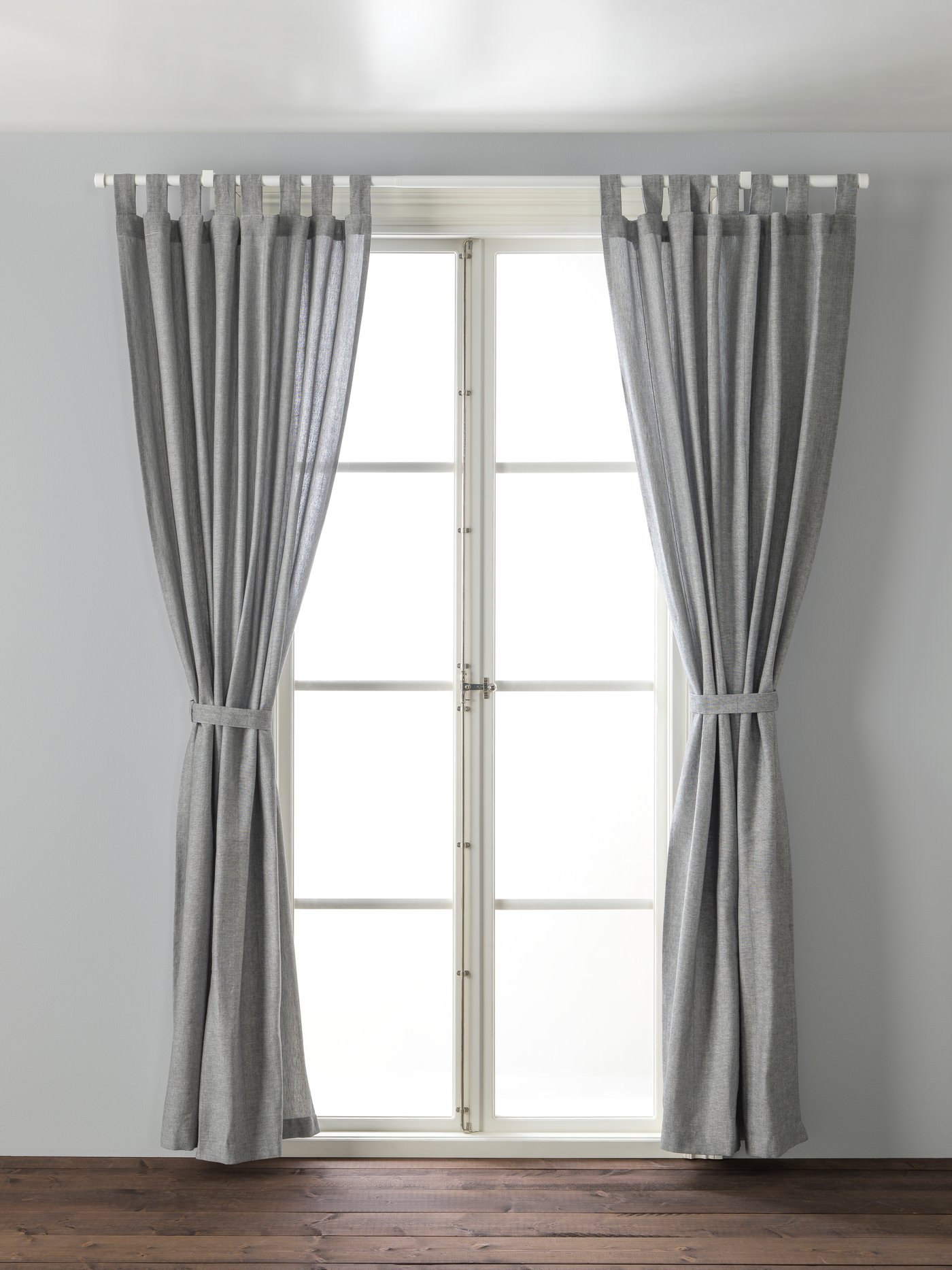 White glass-door cabinet with plinth & cookware stored inside