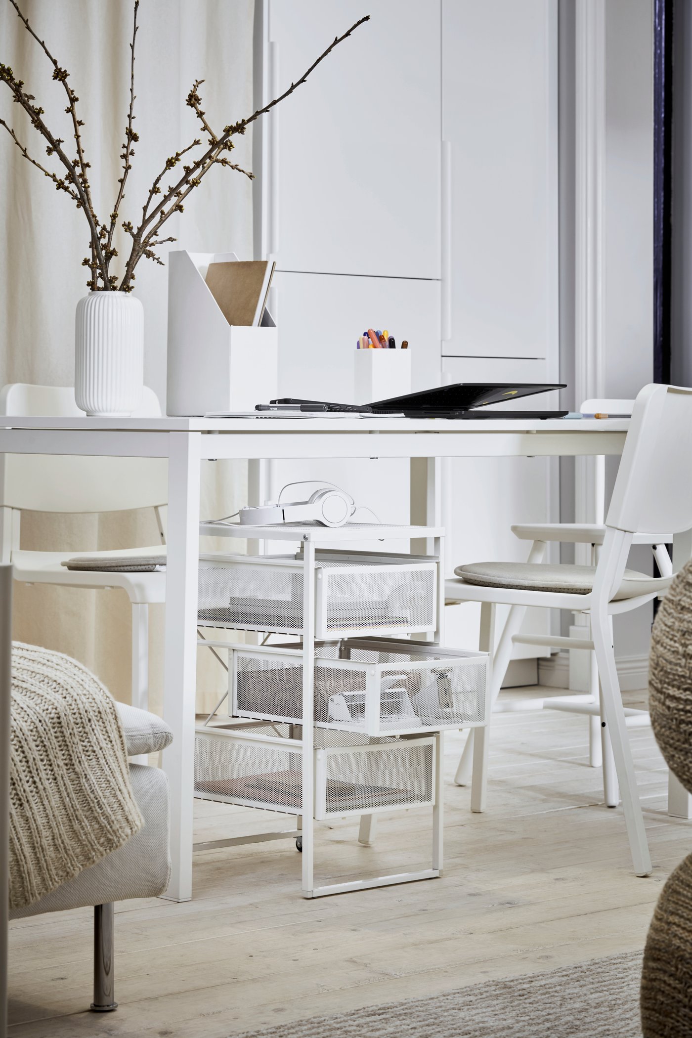 A white TJENA magazine file in the home office