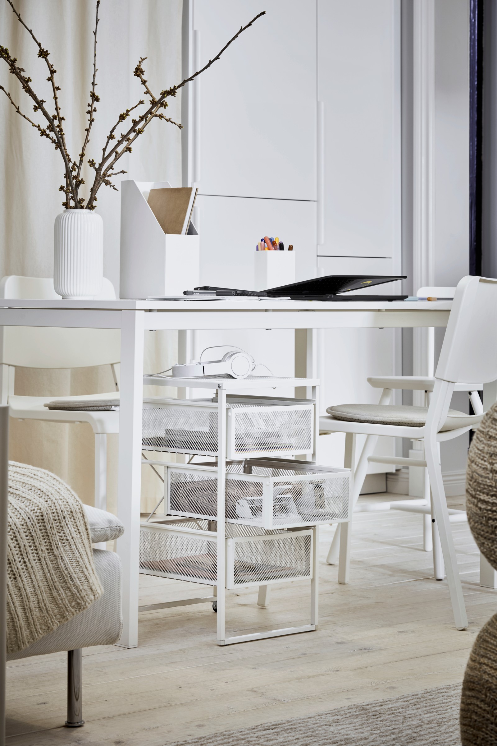 A white TJENA magazine file in the home office