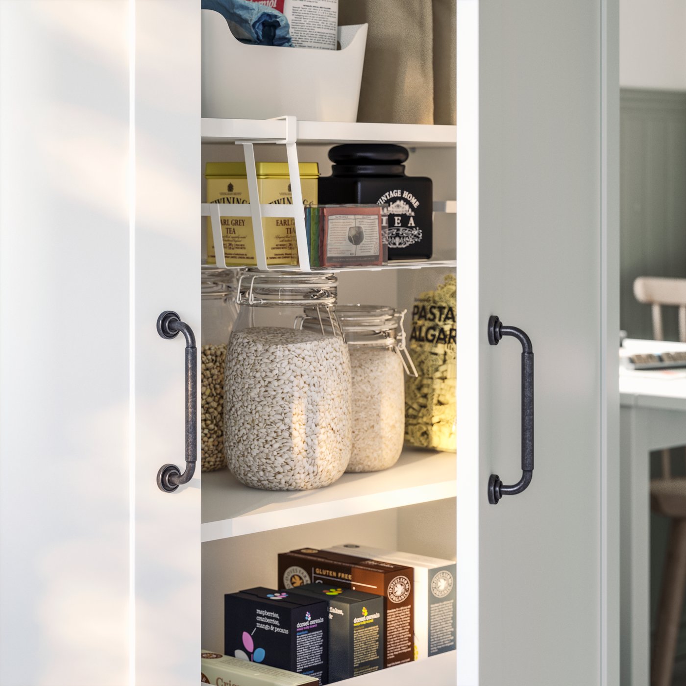 A door in a KNOXHULT high cabinet is slightly ajar and there are food containers and food items stored on the shelves inside.