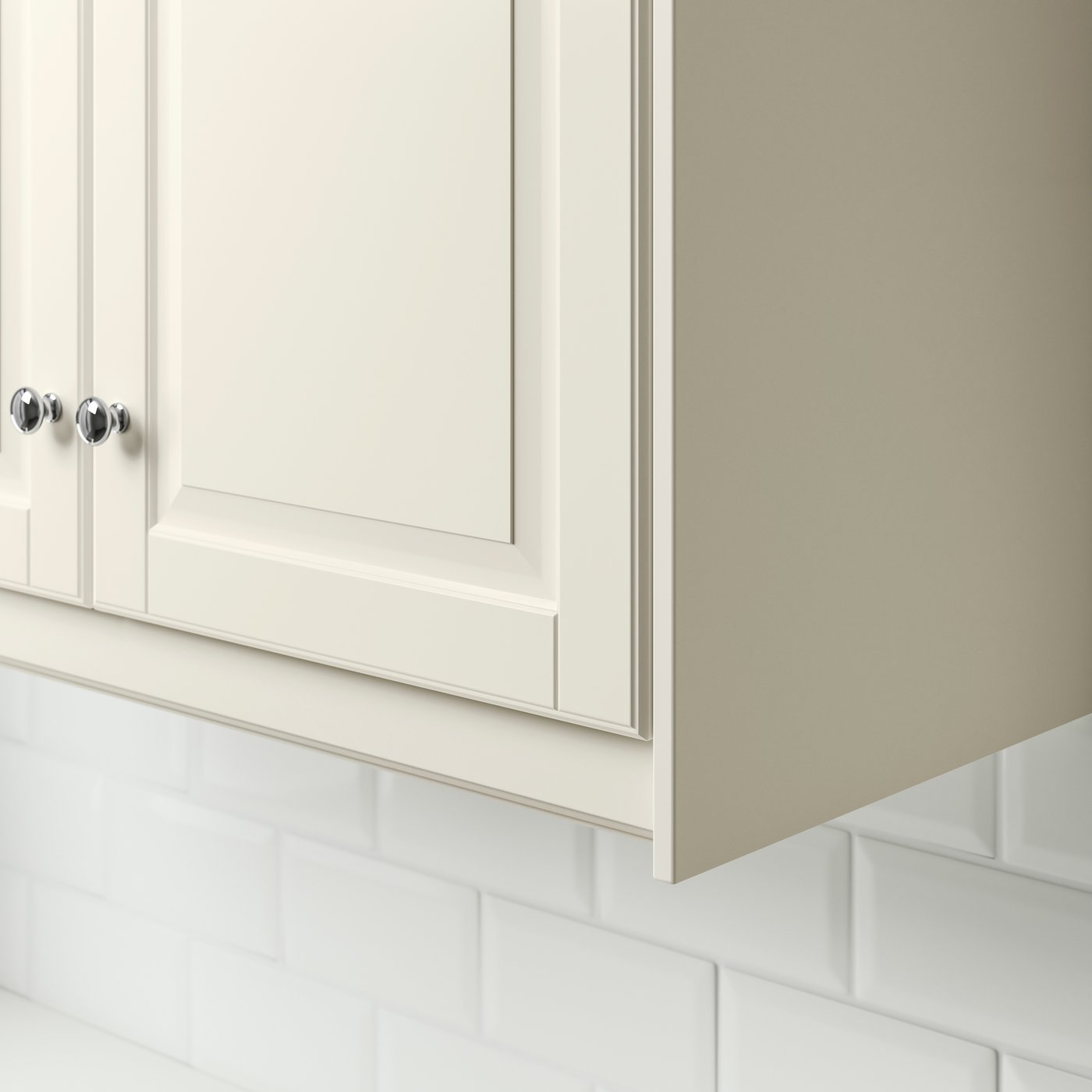 A beige BODBYN kitchen cabinet with a profiled decorative strip/moulding.