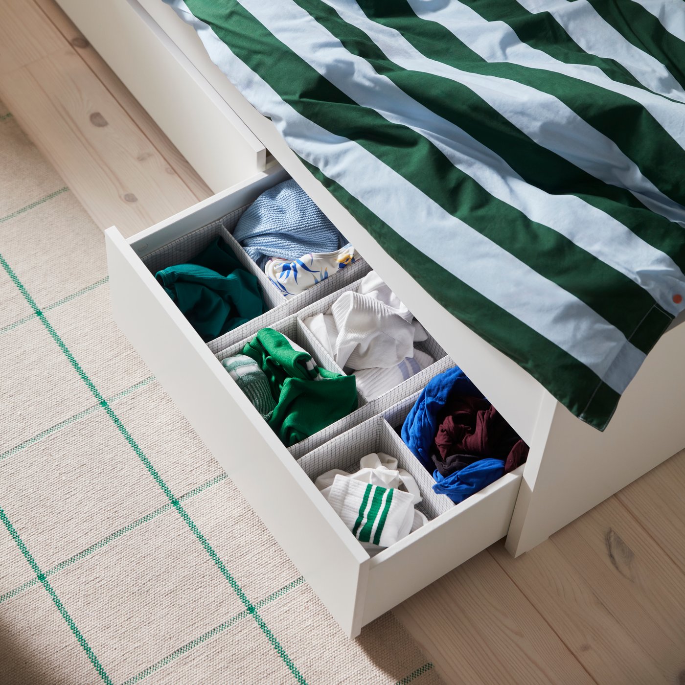 A light blue dark green/stripe SLÅNHÖSTMAL duvet cover and pillowcase in the bedroom