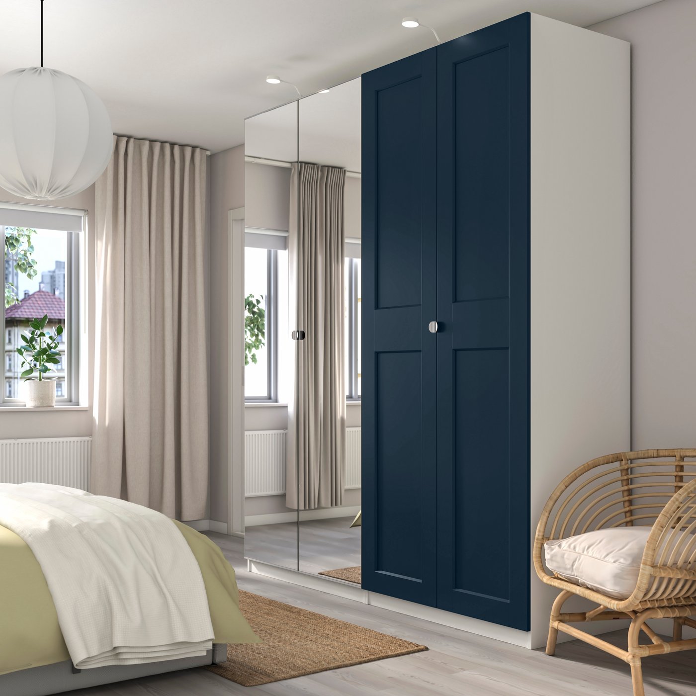 A white/dark blue mirror glass PAX wardrobe combination