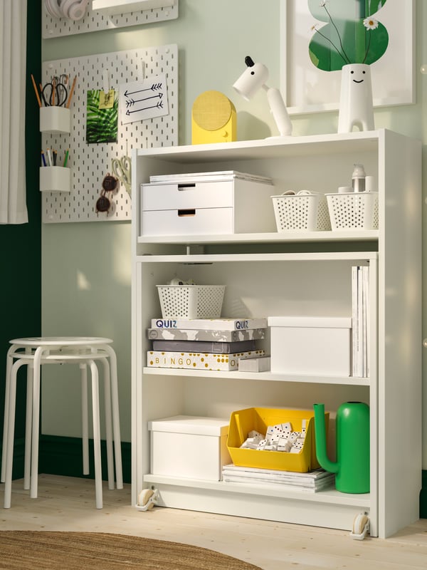A white BILLY bookcase with foldable table