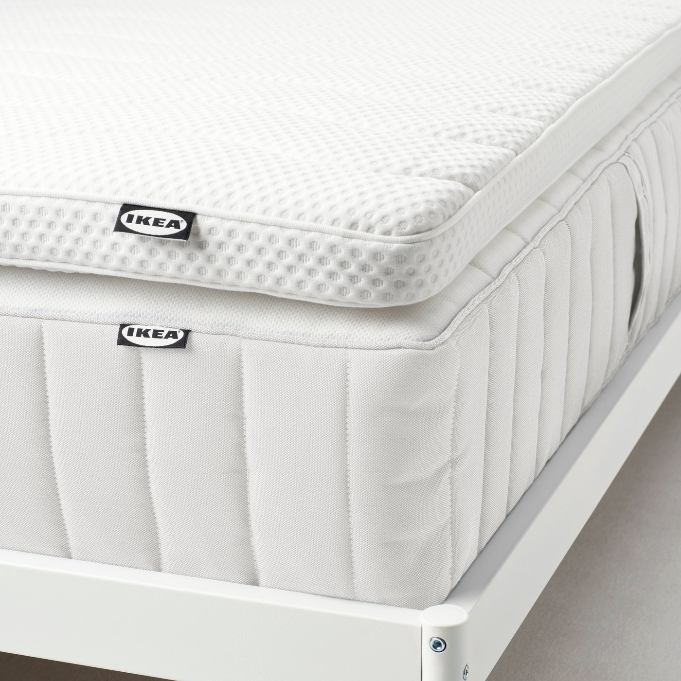 A white NORRSELE mattress pad