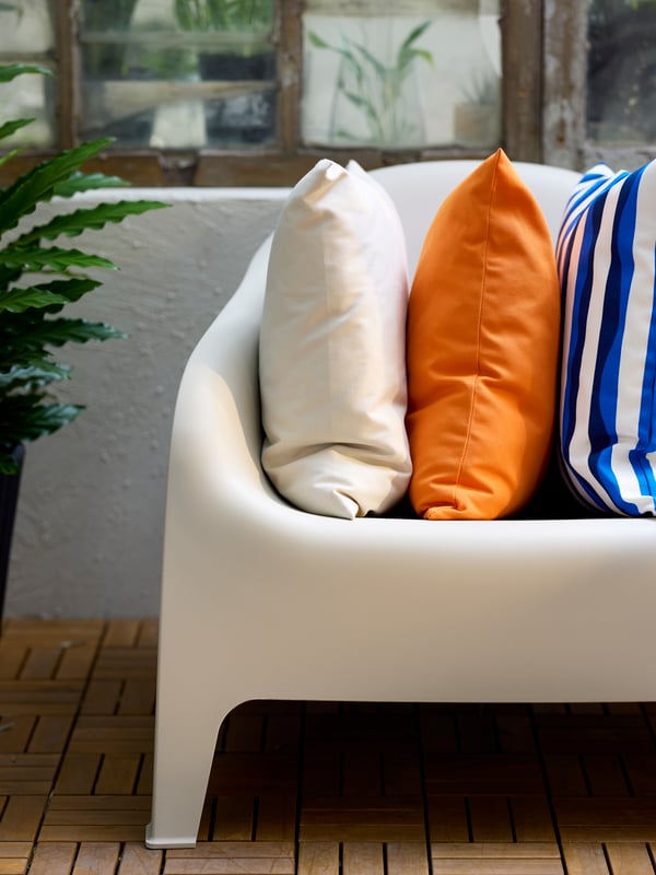 A white SKARPÖ armchair, outdoor outside
