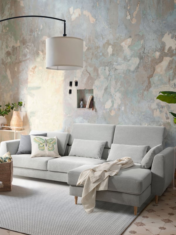 An IKEA SLATORP 3 seater sofa with chaise longue with a Tallmyra white/black fabric cover