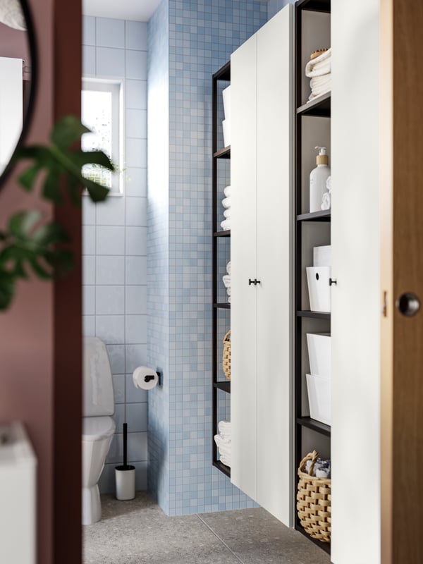 Two white ENHET high cabinets with 4 shelves and doors and two ENHET high frames with shelves in anthracite.