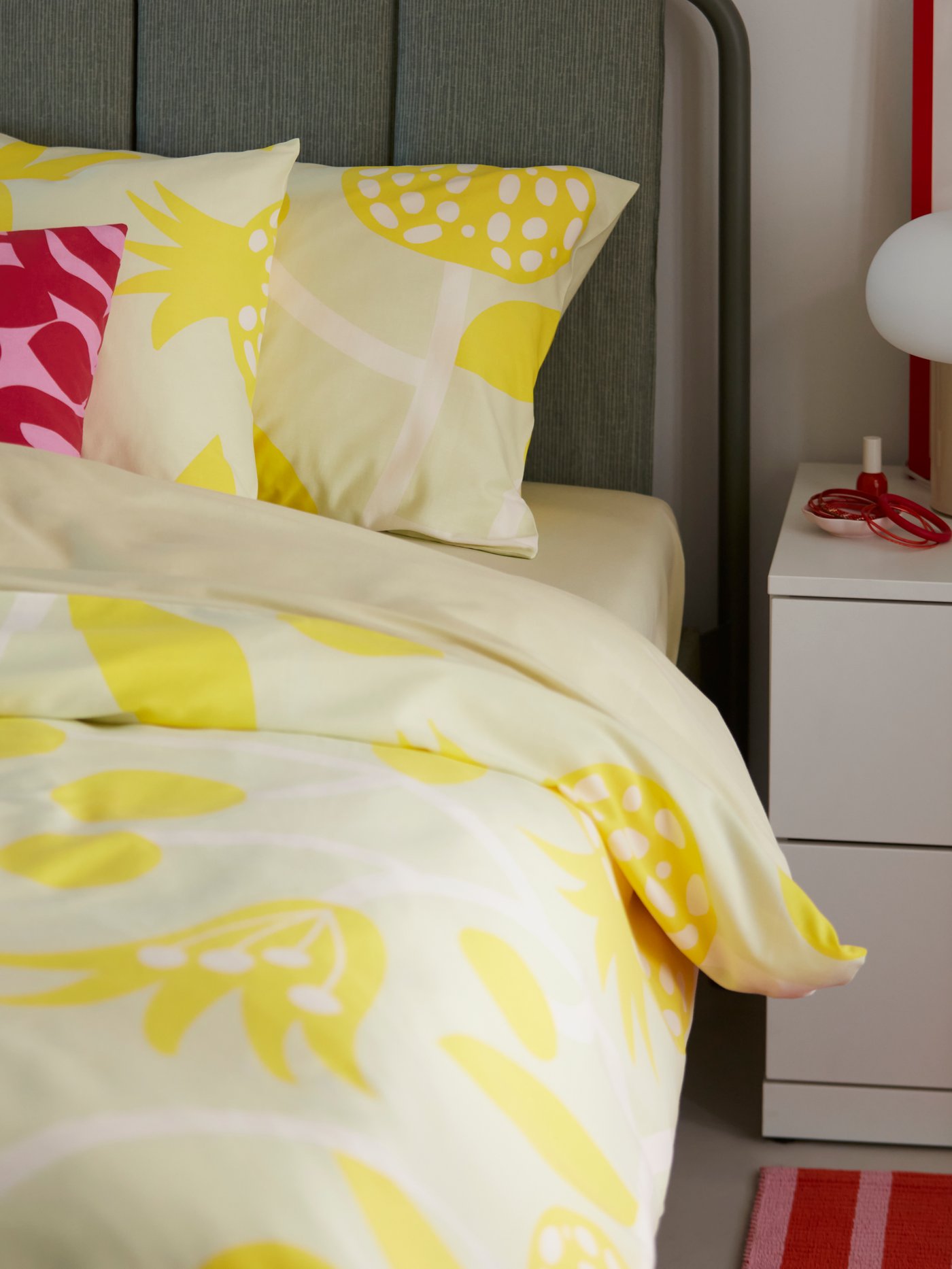 A pomegranate/yellow FÖSSTA duvet cover and pillowcase