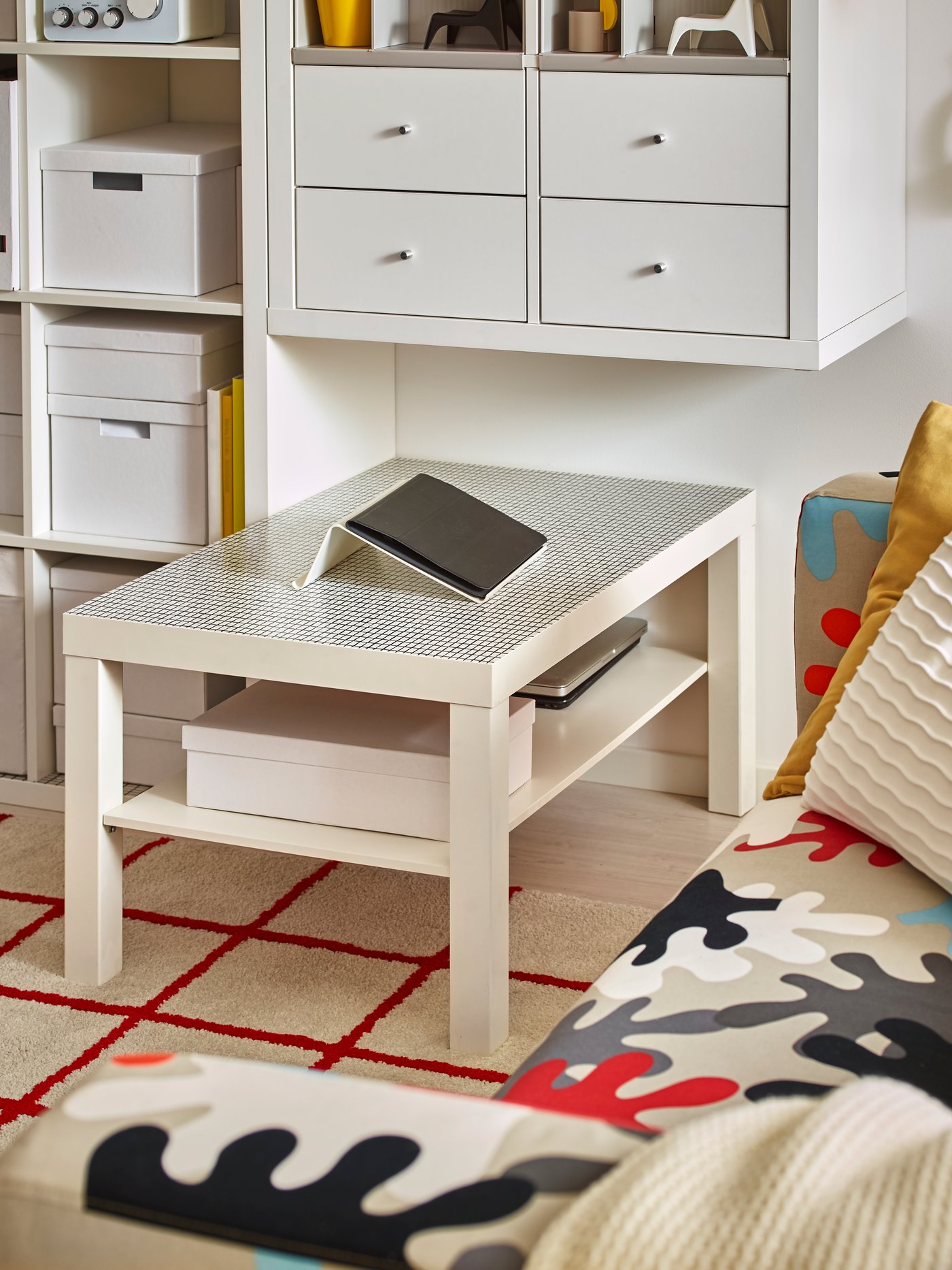 A white KALLAX shelving unit in the living room