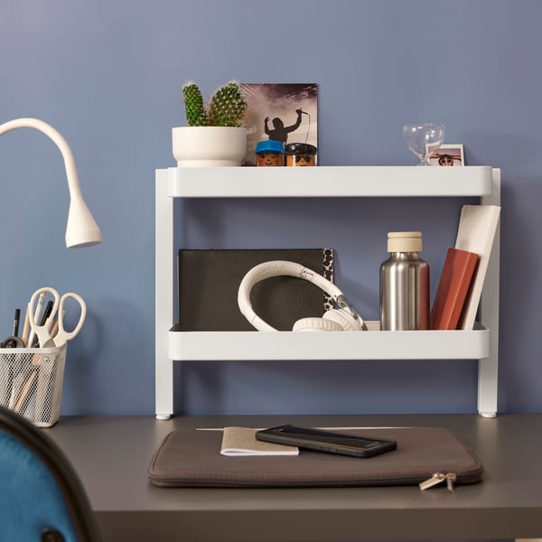 A white VATTENKAR desktop shelf