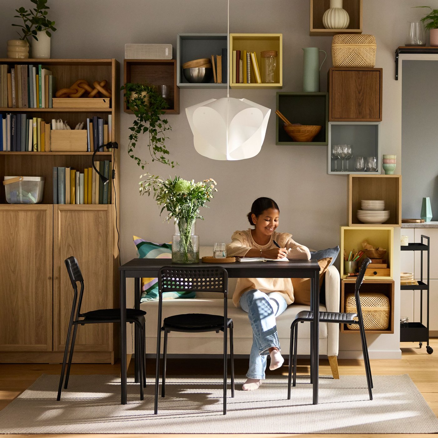 A light grey-blue EKET cabinet in the dining room