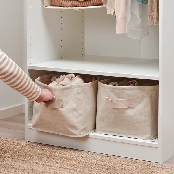 A textile/beige PURRPINGLA storage basket