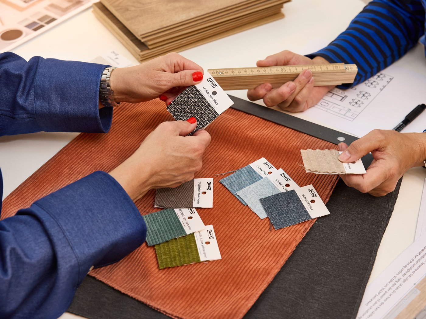 people holding paint swatches