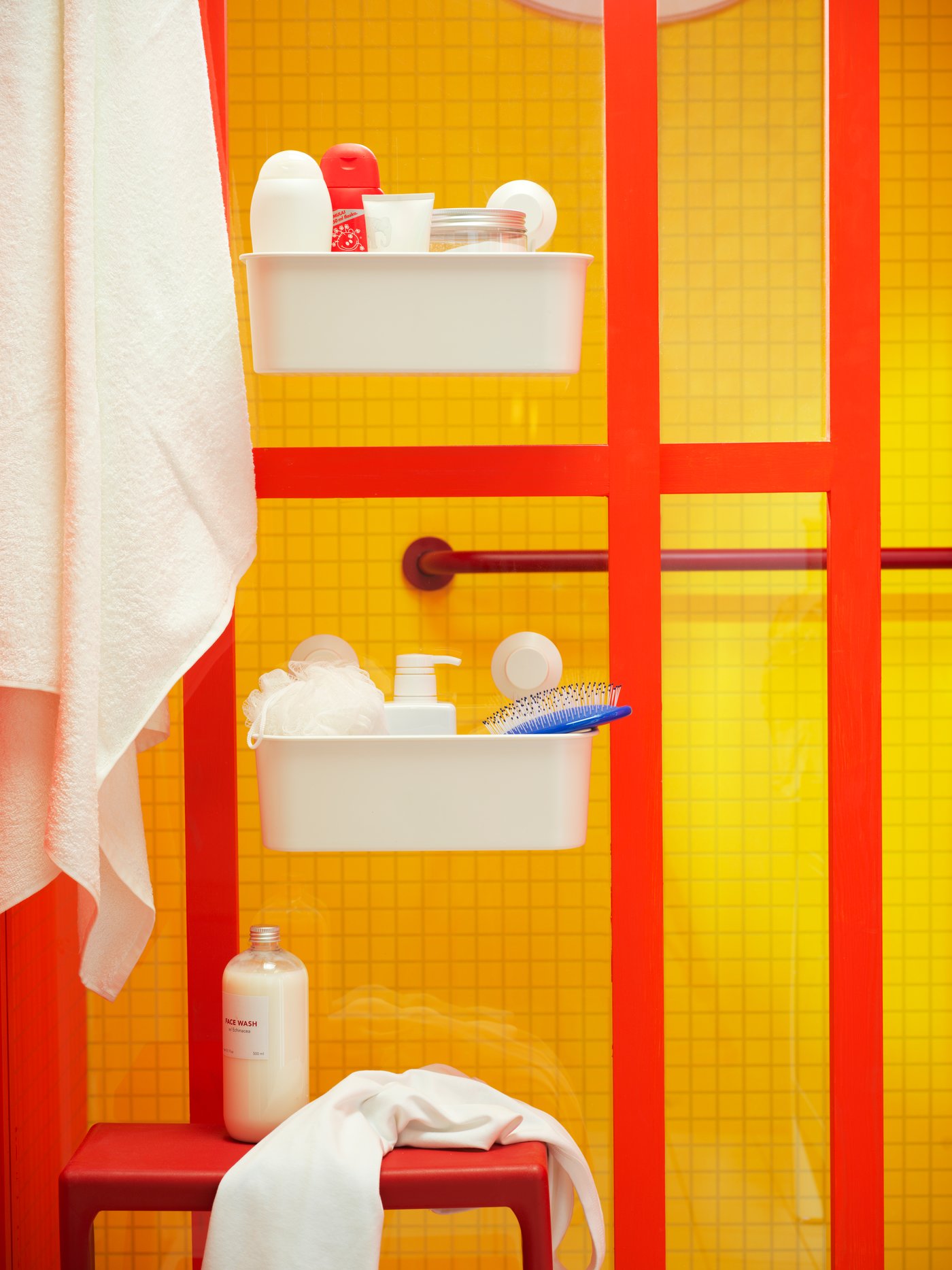 A white TISKEN basket with suction cup in the bathroom