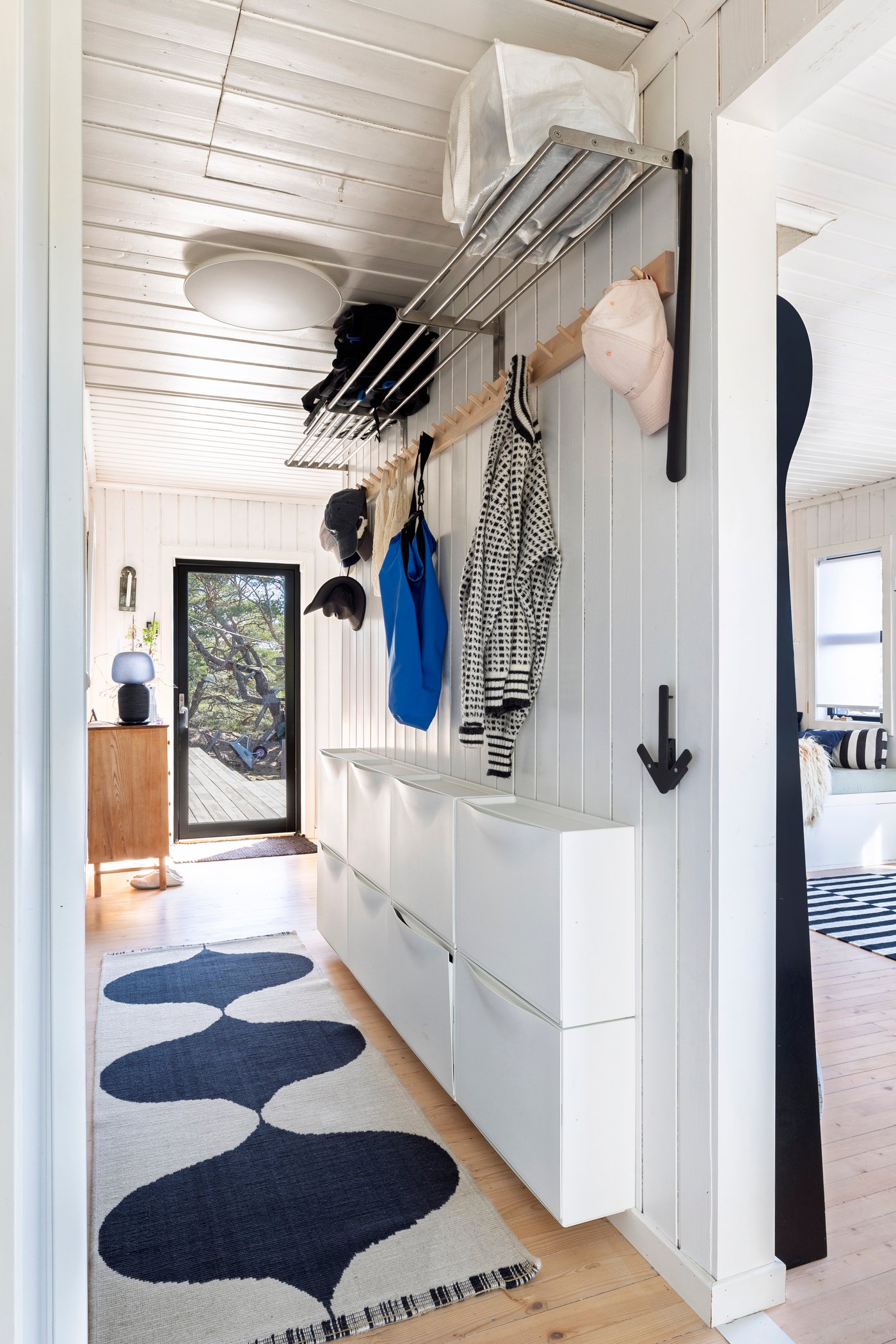 A white TRONES shoe cabinet/storage