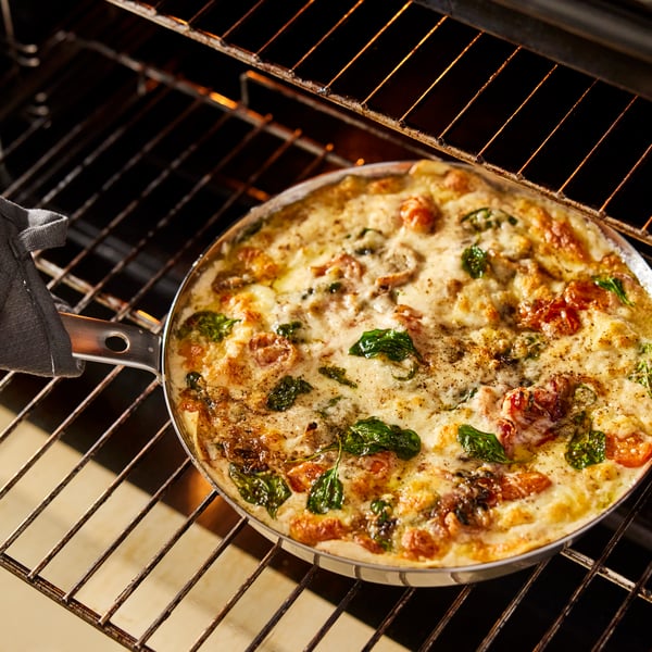 A stainless steel HEMKOMST frying pan