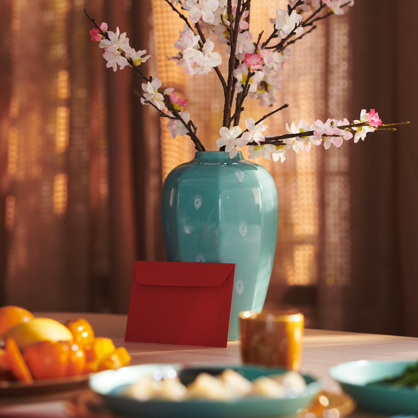 Close up of the FÖSSTA cushion cover that looks like a dragon’s head lying against the armrest of a sofa.