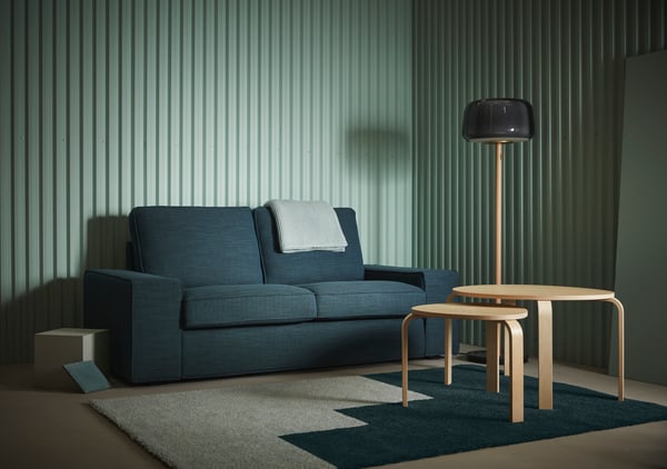 A light blue/green KONGSTRUP rug, high pile in the living room