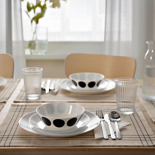 A white black/dot pattern OFTAST bowl in the dining room