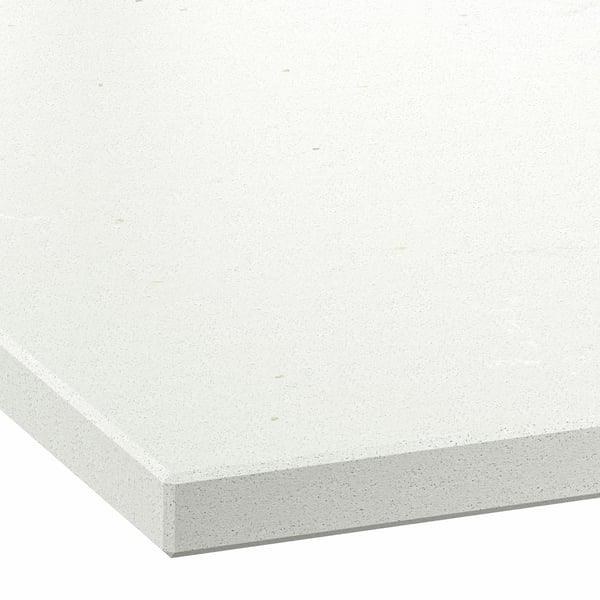 Close-up of a solid white countertop with a smooth, matte finish and minimal speckling.