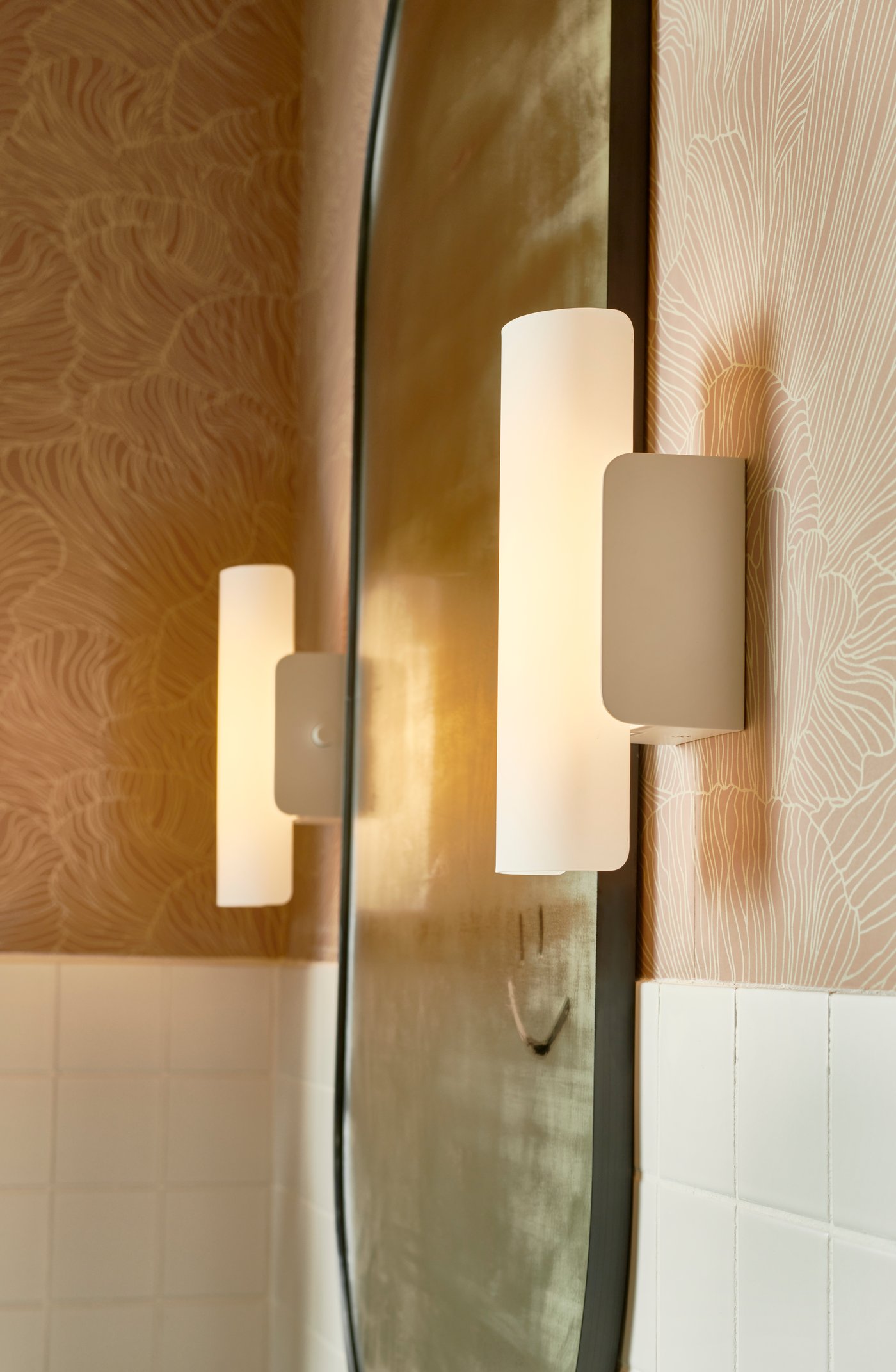 A dimmable white/frosted glass white HAVSDUN LED wall lamp in the bathroom