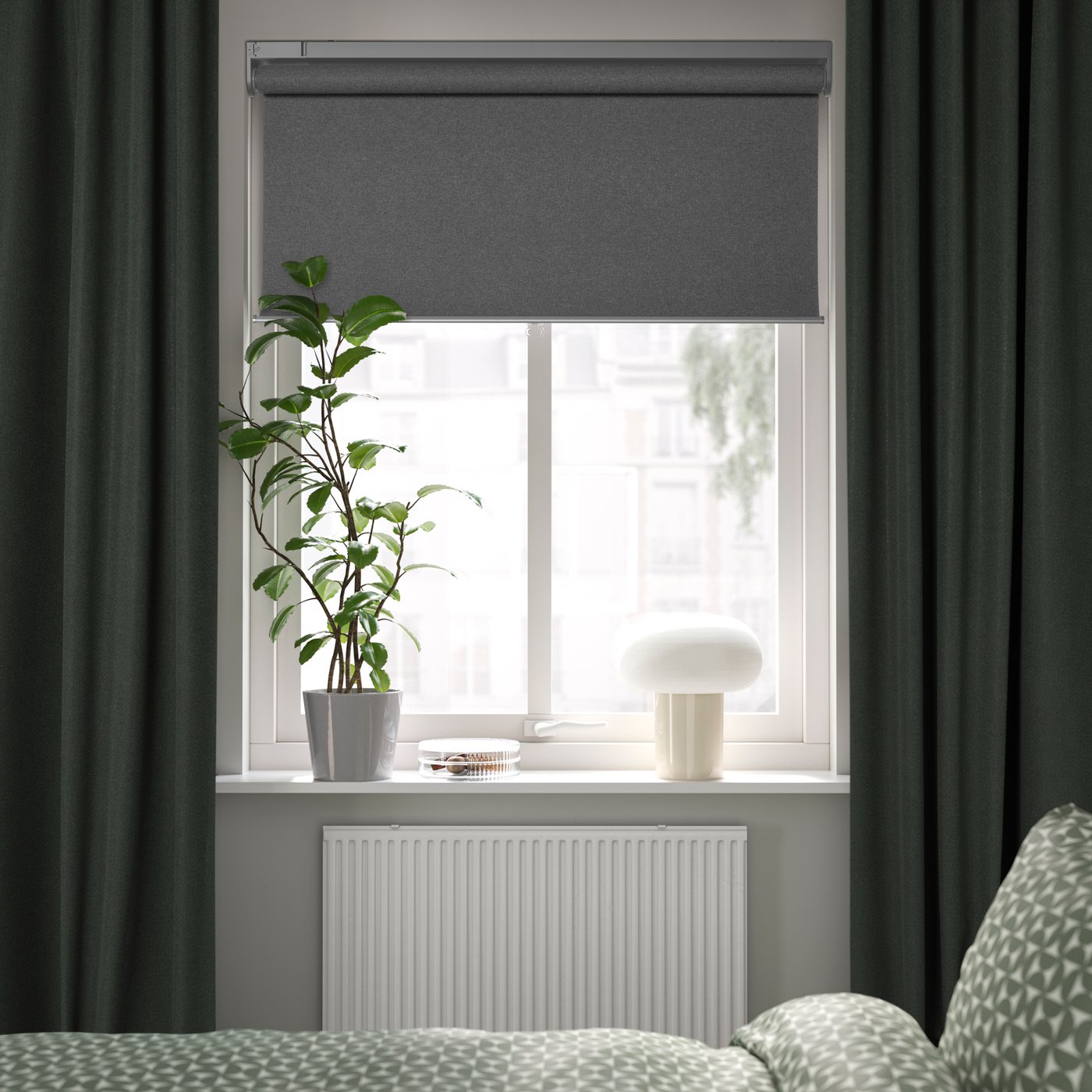 A smart wireless/battery-operated grey FYRTUR block-out roller blind