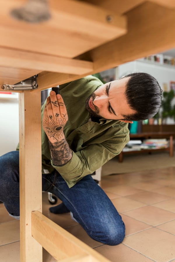 A man repairing his table 