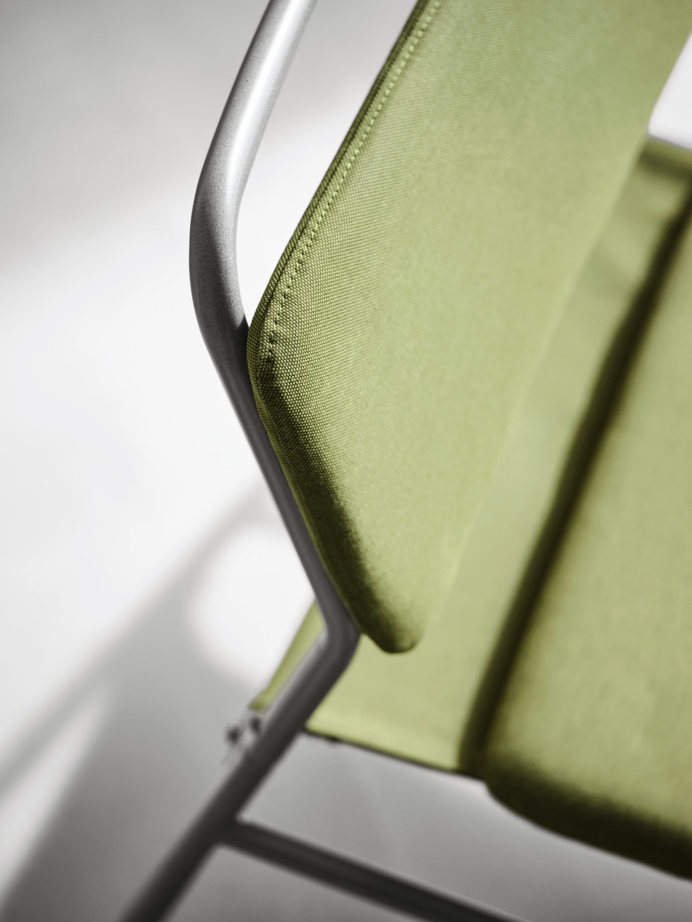 An Orrsta olive-green LINNEBÄCK easy chair