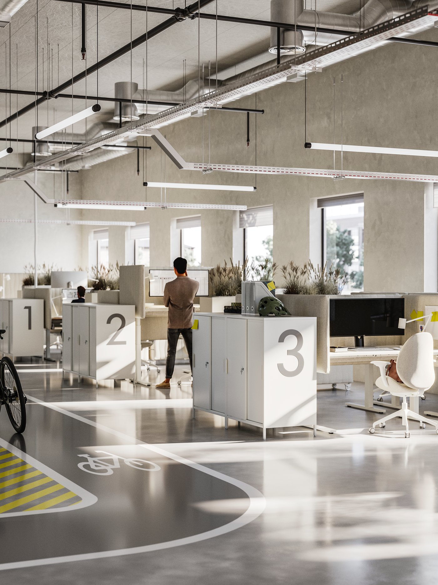 Tre file di scrivanie in un ufficio open space arioso. Ogni stazione di lavoro è dotata di schermi acustici e sedute ergonomiche.