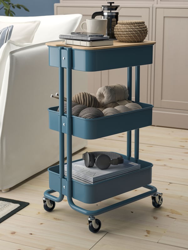A grey-blue RÅSKOG trolley