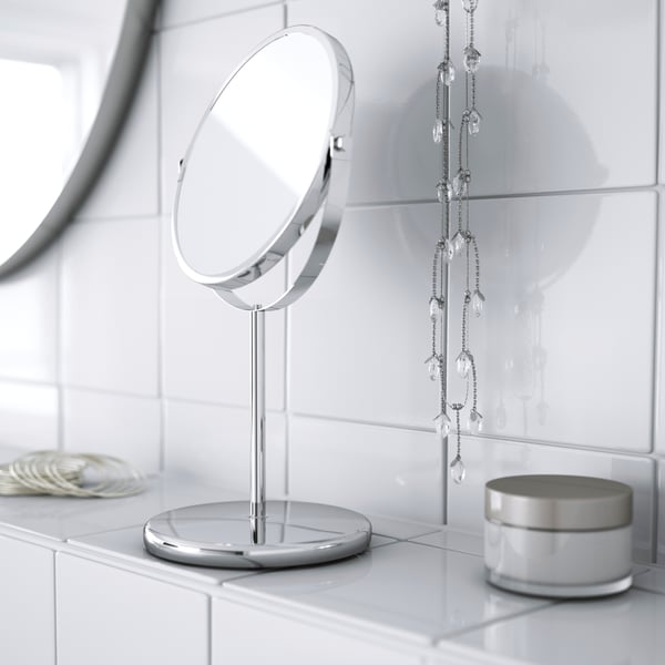 A stainless steel TRENSUM mirror