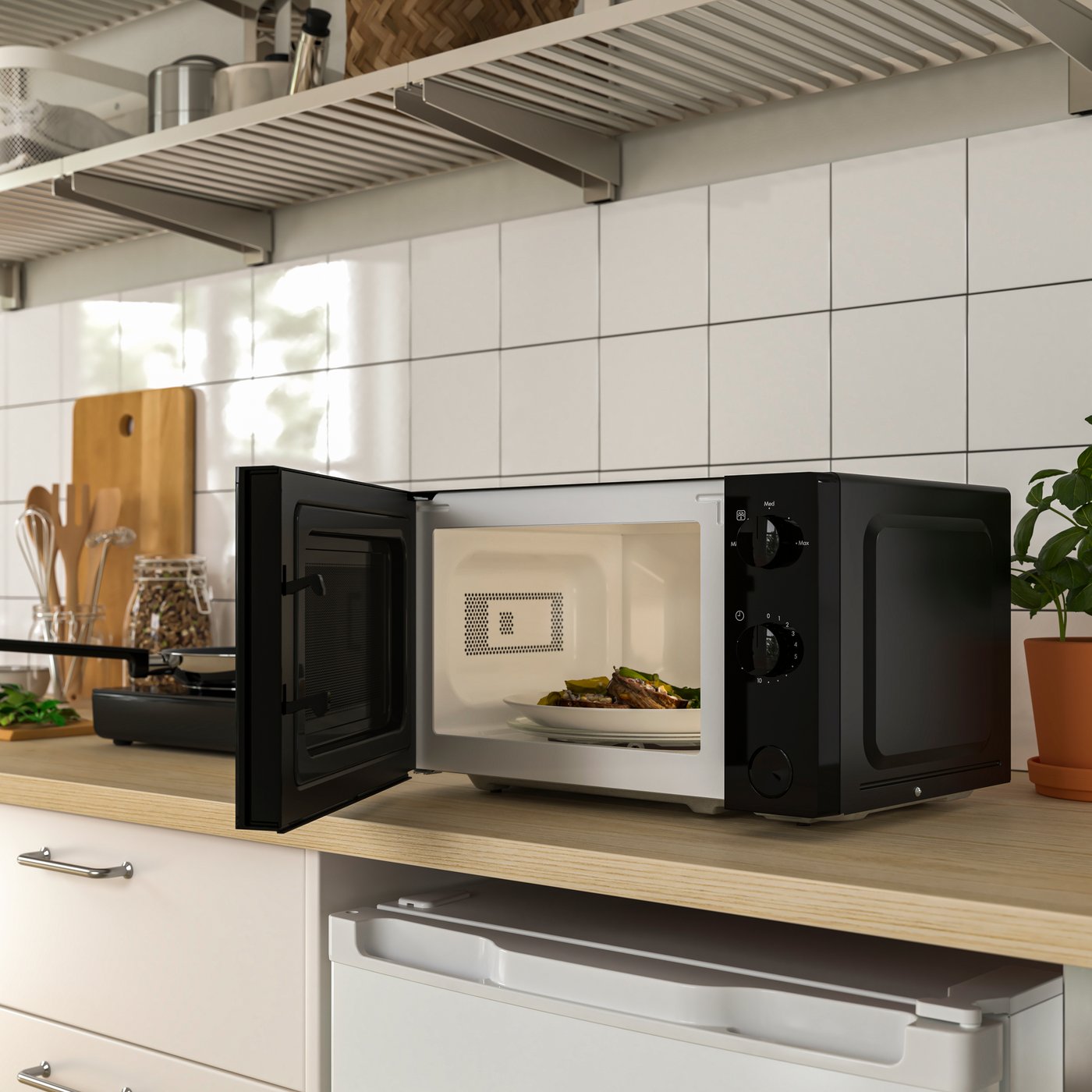 A black TILLREDA microwave oven