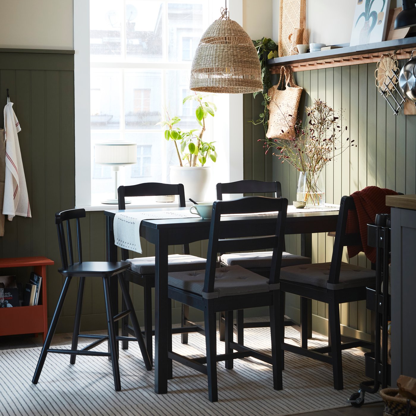 A black stained pine HÄGERNÄS table and 4 chairs
