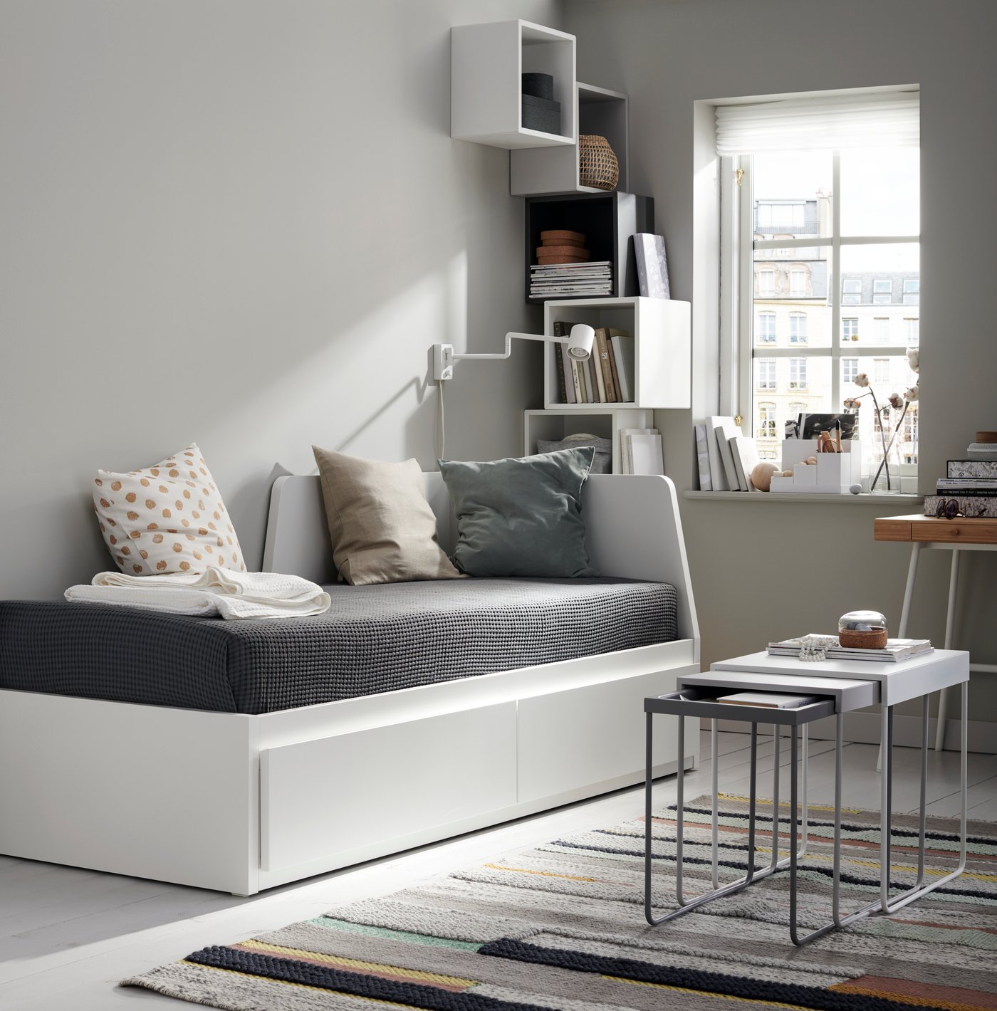 A white EKET cabinet in the living room