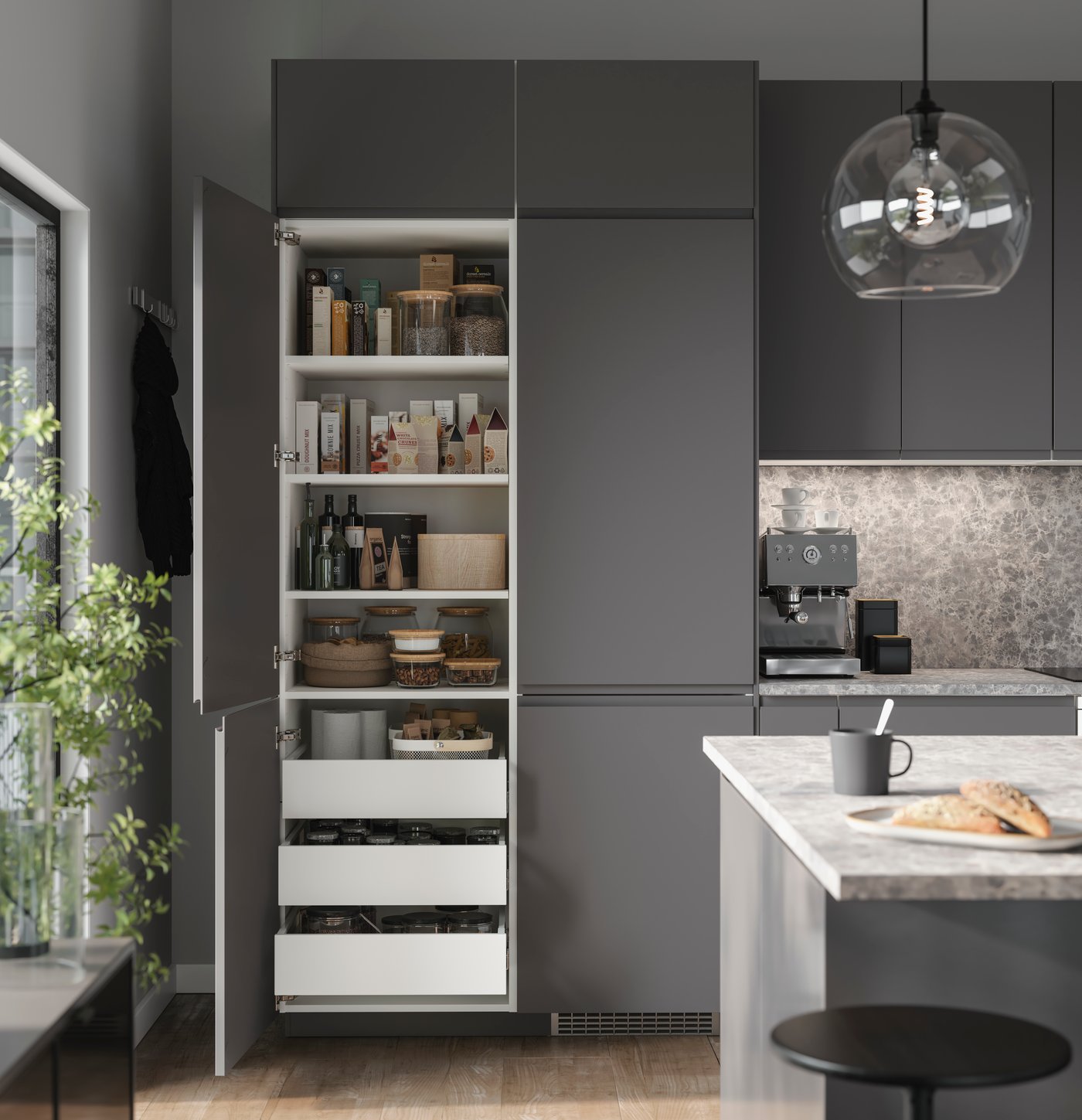 A white UTRUSTA drawer front, medium in the kitchen