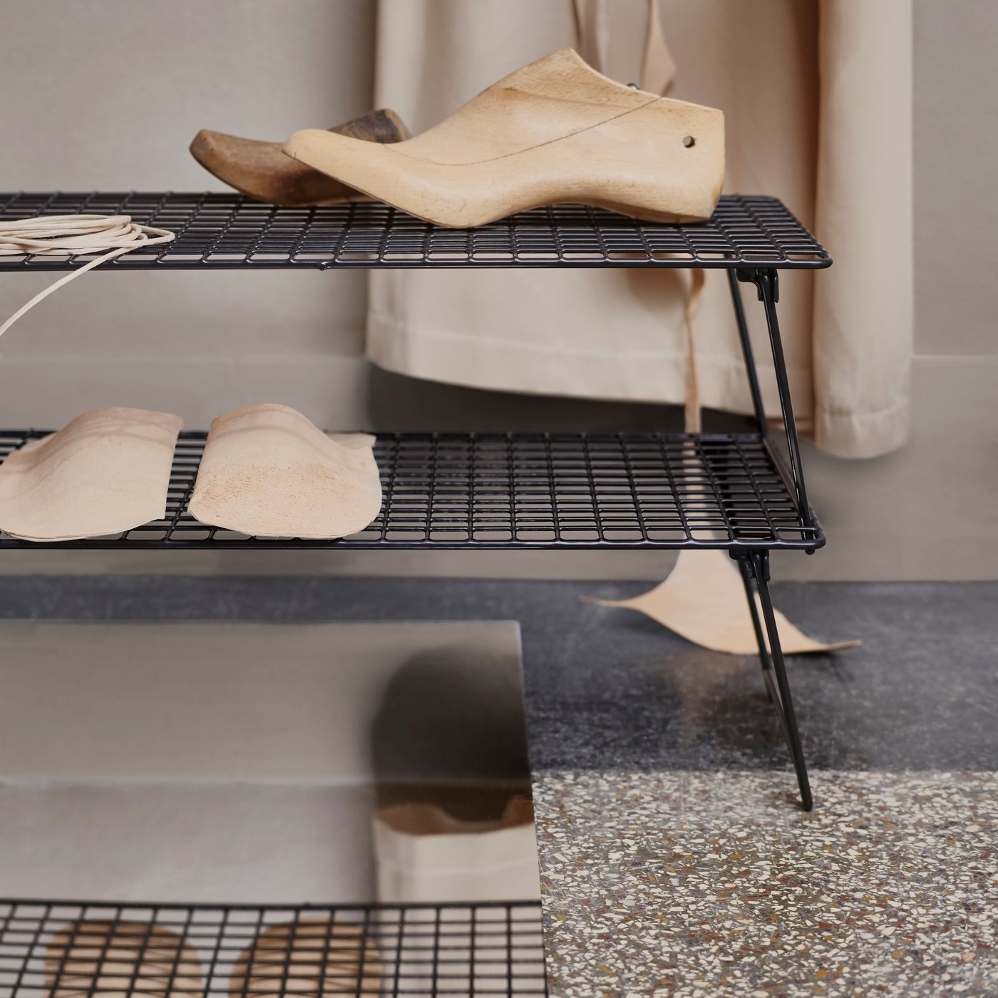 A grey GREJIG shoe rack