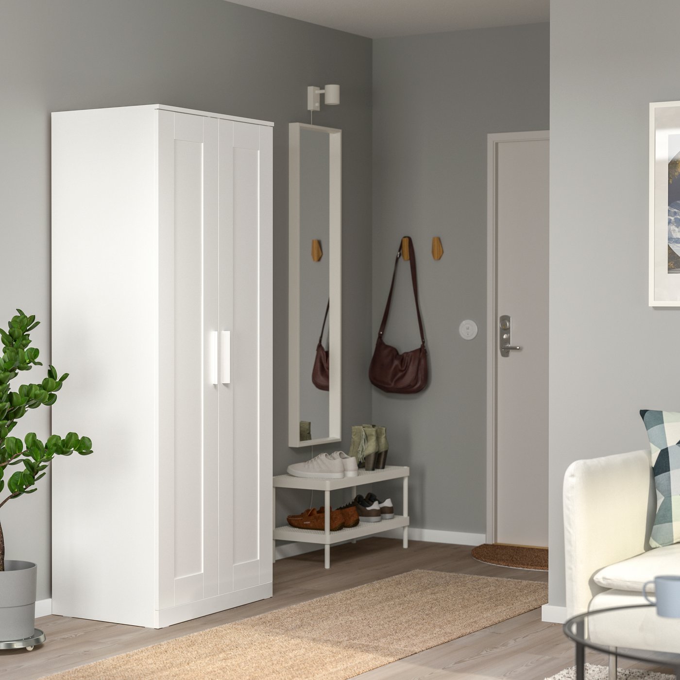 A white BRIMNES wardrobe with 2 doors in the hallway