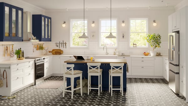 a table with chairs in the middle of a white kitchen