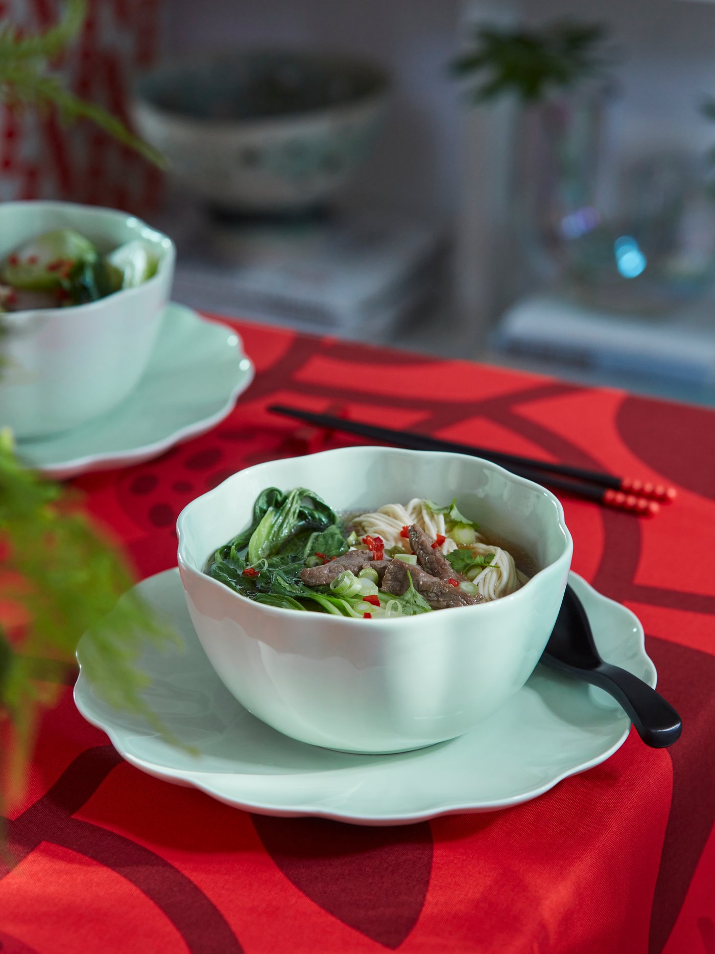 A red FÖSSTA tablecloth