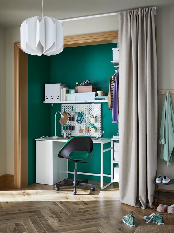 A white LÄRANDE desk with pull-out storage unit