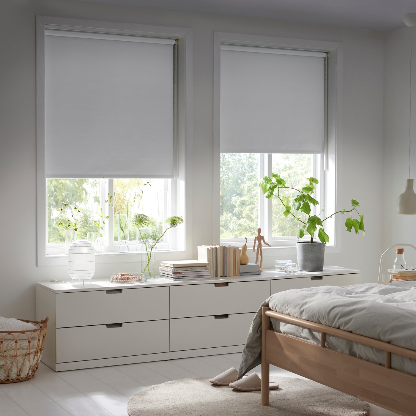 A white FRIDANS block-out roller blind