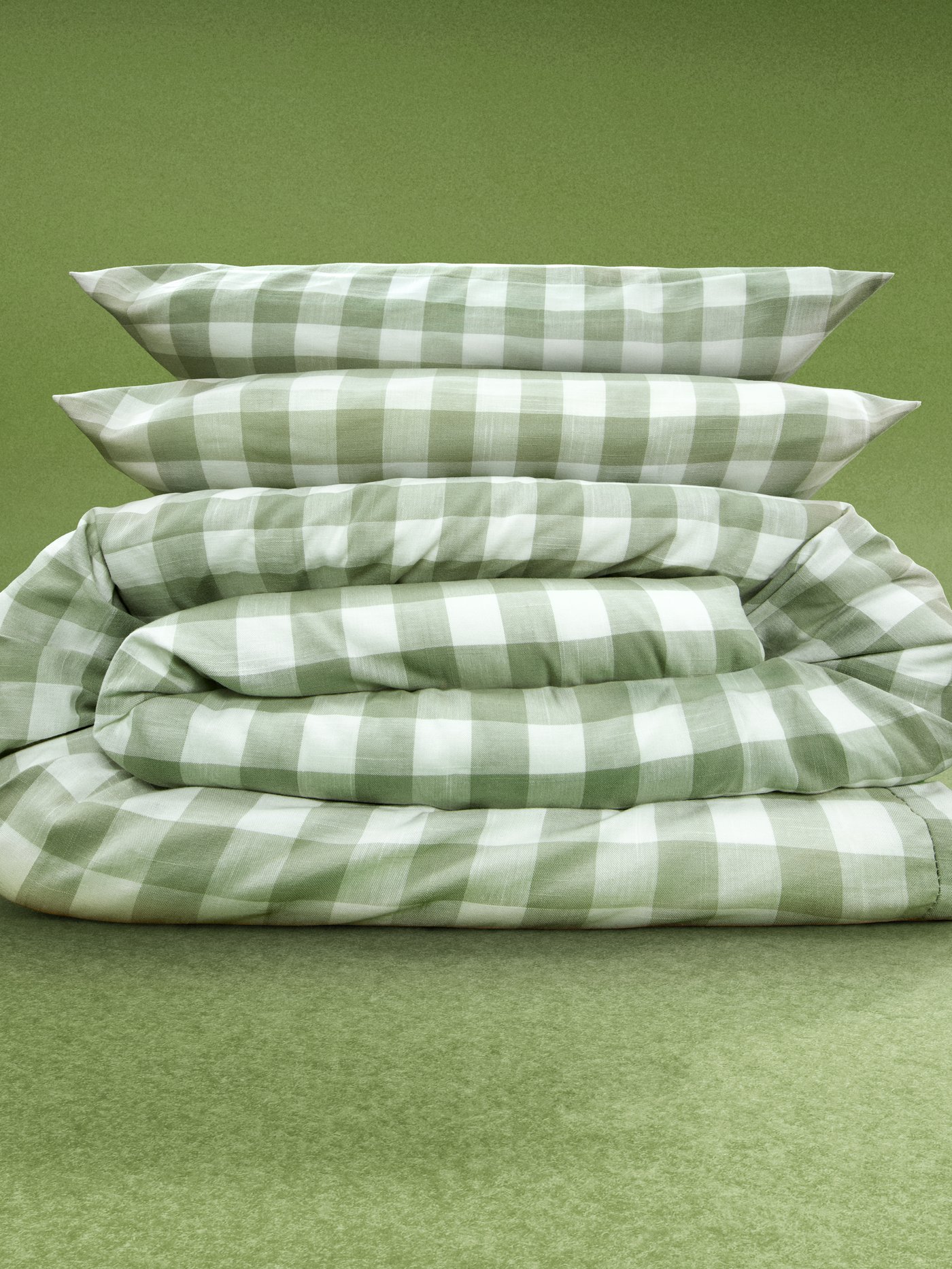 Green checkered bedding on a green background