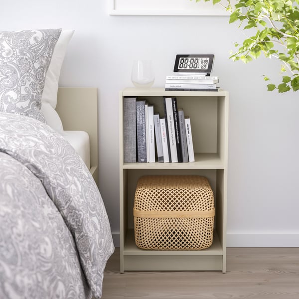 A light beige GURSKEN bedside table in the bedroom