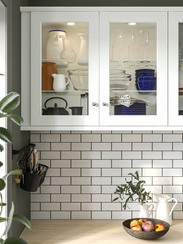 STRIMMIG bowls inside a kitchen cabinet