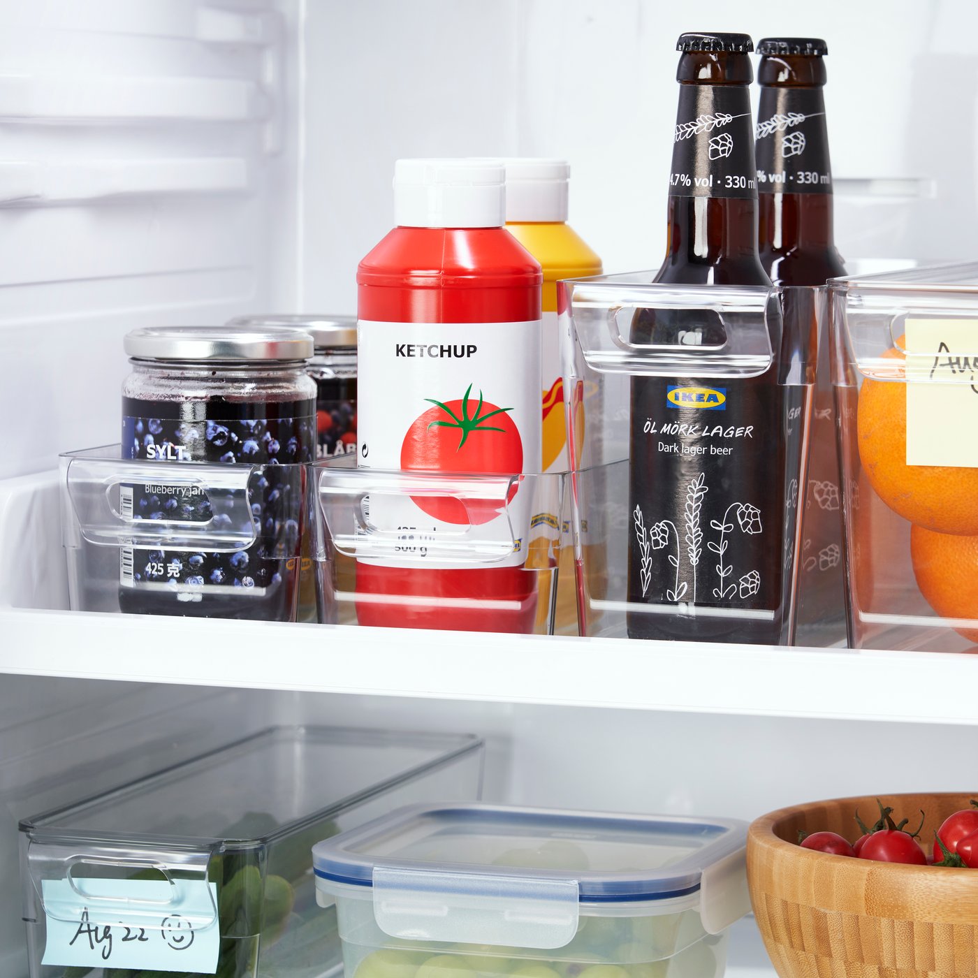 A transparent KLIPPKAKTUS storage box for fridge