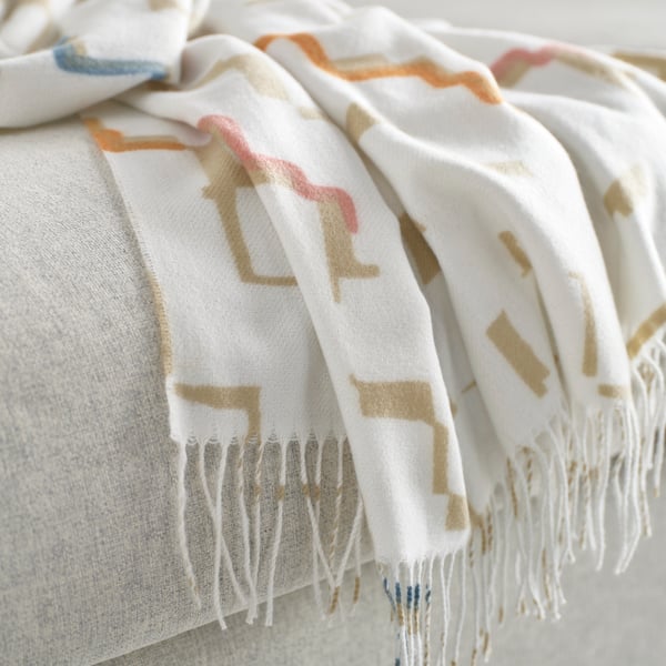 An off-white/multicolour OLIVSPINNMAL throw